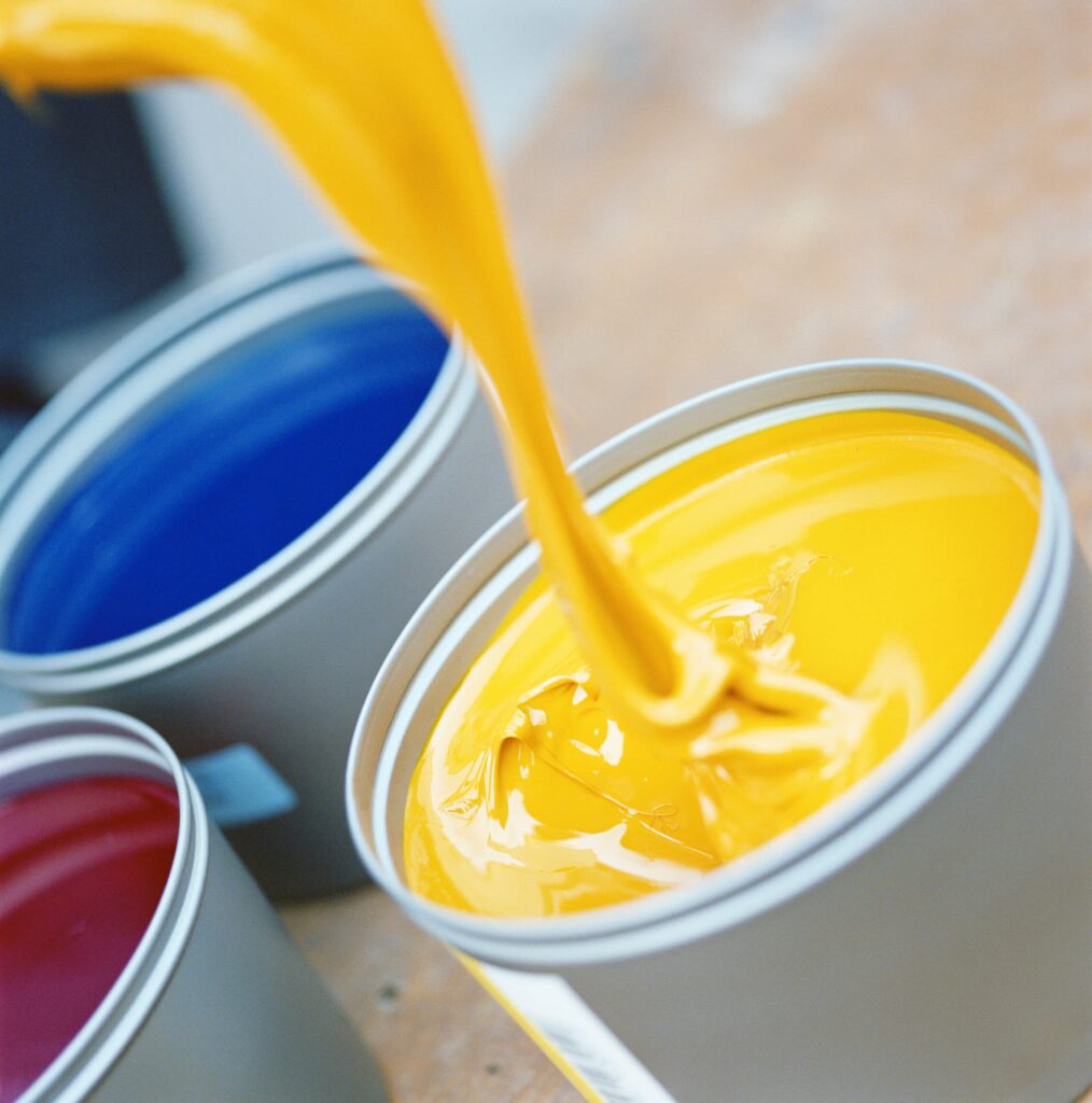 Paint pouring into a paint can - Flow cup measurement